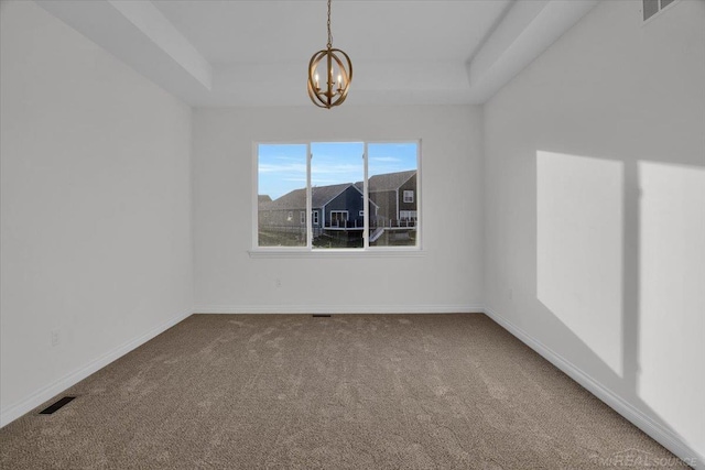 27645 Maryjane Ln E, Chesterfield Twp, MI 48047 - carpeted spare room with a chandelier, a tray ceiling, and baseboards