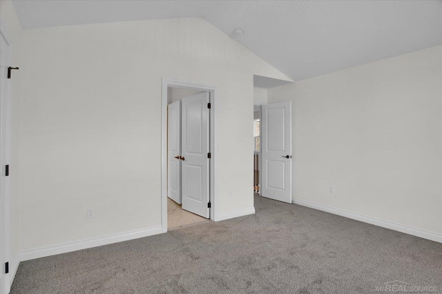 27645 Maryjane Ln E, Chesterfield Twp, MI 48047 - empty room with carpet, lofted ceiling, and baseboards