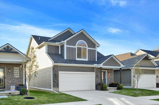 27645 Maryjane Ln E, Chesterfield Twp, MI 48047 - view of front facade with concrete driveway, brick siding, a garage, and a front lawn