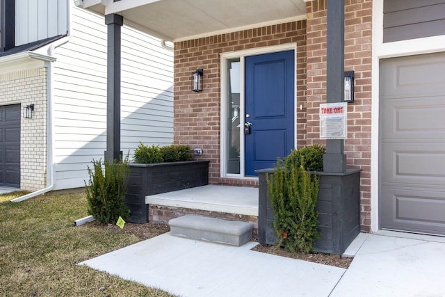 27632 Maryjane Ln E, Chesterfield Twp, MI 48047 - doorway to property featuring brick siding and covered porch
