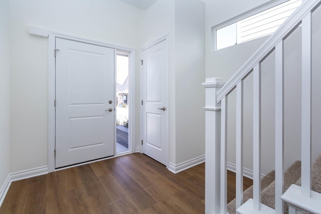27632 Maryjane Ln E, Chesterfield Twp, MI 48047 - foyer with stairway, dark wood finished floors, and baseboards