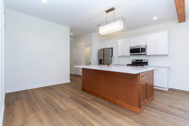 27632 Maryjane Ln E, Chesterfield Twp, MI 48047 - kitchen with stainless steel appliances, light wood-style flooring, baseboards, a kitchen island with sink, and recessed lighting