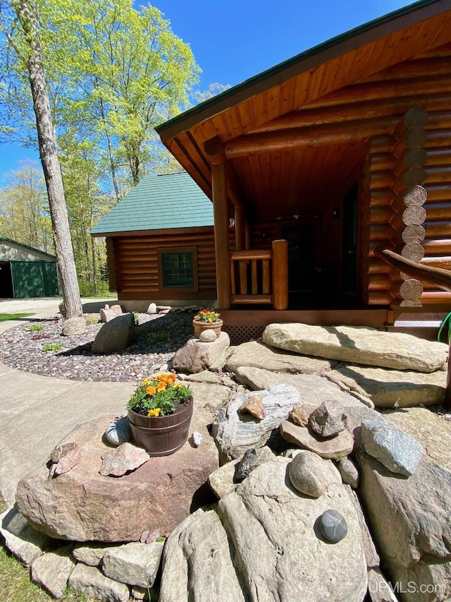 E1849 H44 Hwy, Trenary, MI 49891 - doorway to property featuring log siding