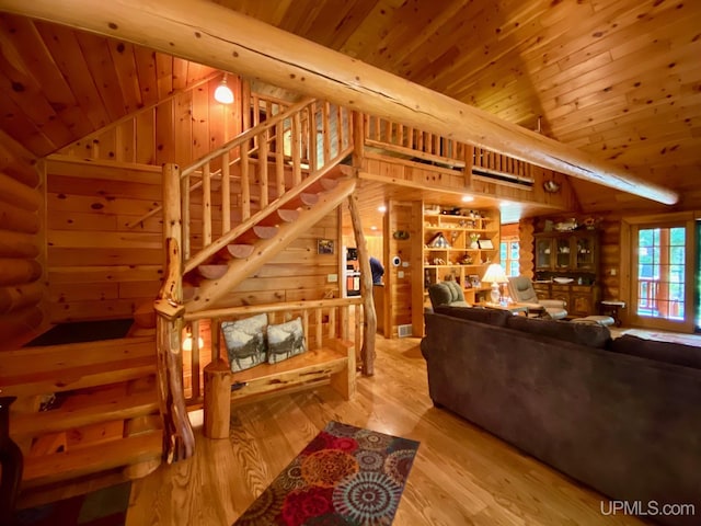 E1849 H44 Hwy, Trenary, MI 49891 - living area featuring log walls, wood ceiling, lofted ceiling, and wood finished floors