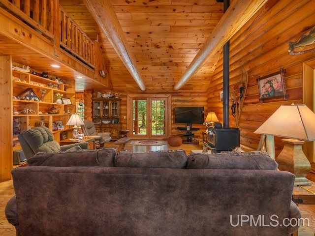 E1849 H44 Hwy, Trenary, MI 49891 - living room featuring rustic walls, wood finished floors, wood ceiling with exposed beams, and a wood stove