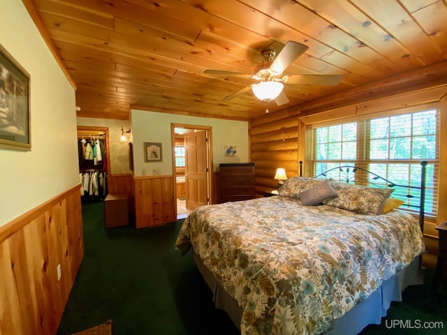 E1849 H44 Hwy, Trenary, MI 49891 - bedroom featuring wooden ceiling, wainscoting, multiple windows, a walk in closet, and a closet