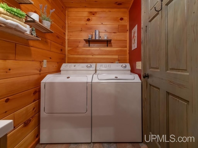 E1849 H44 Hwy, Trenary, MI 49891 - laundry area featuring washing machine and dryer and wood walls