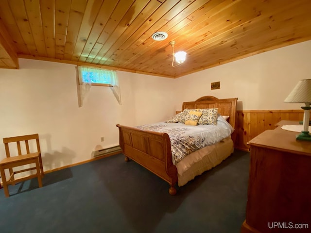 E1849 H44 Hwy, Trenary, MI 49891 - bedroom with wooden ceiling, dark carpet, a baseboard radiator, and a wainscoted wall