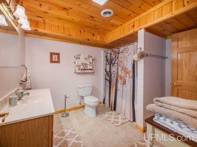 E1849 H44 Hwy, Trenary, MI 49891 - full bath featuring wood ceiling, vanity, toilet, baseboards, and tile patterned floors