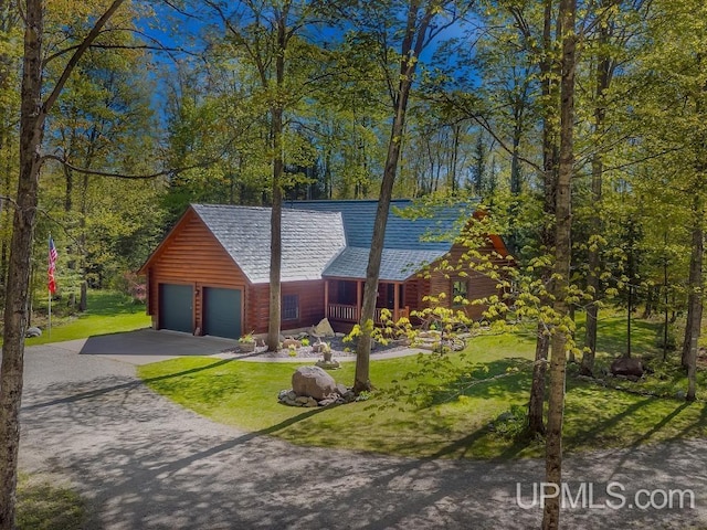 E1849 H44 Hwy, Trenary, MI 49891 - log-style house featuring a front yard, driveway, and log exterior