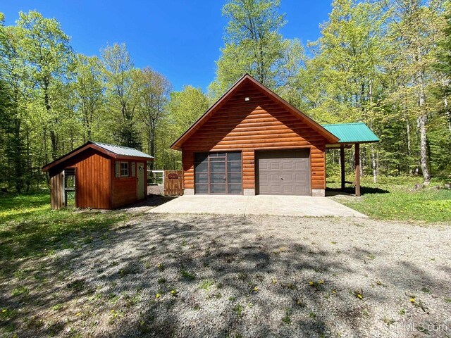 E1849 H44 Hwy, Trenary, MI 49891 - detached garage featuring a forest view