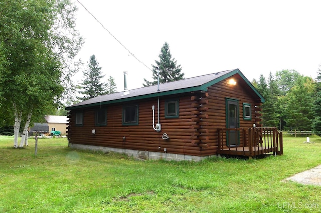 22252 E Webb Rd, Grand Marais, MI 49839 - view of home's exterior featuring log siding and a yard