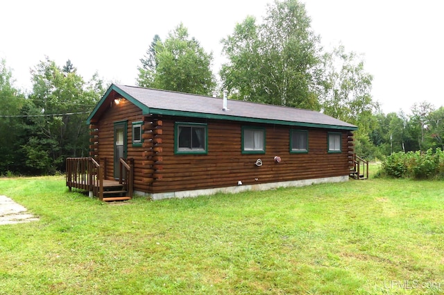 22252 E Webb Rd, Grand Marais, MI 49839 - back of property featuring log exterior and a lawn