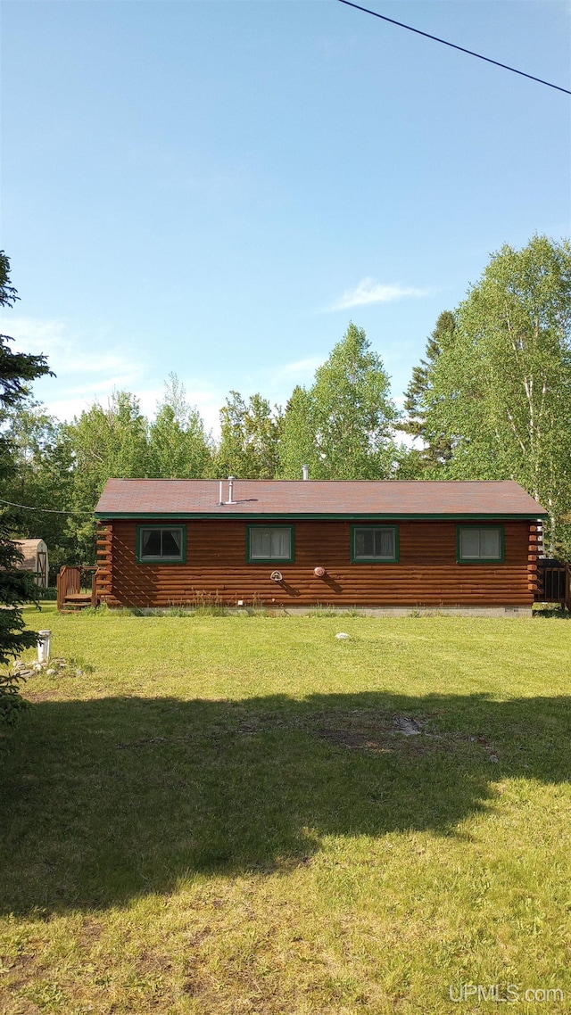 22252 E Webb Rd, Grand Marais, MI 49839 - view of front facade with a front lawn