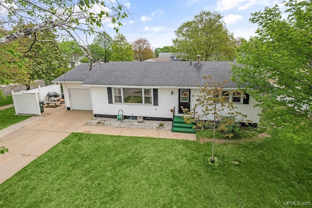 901 S 19th St, Escanaba, MI 49829 - ranch-style house with a garage, a shingled roof, and driveway