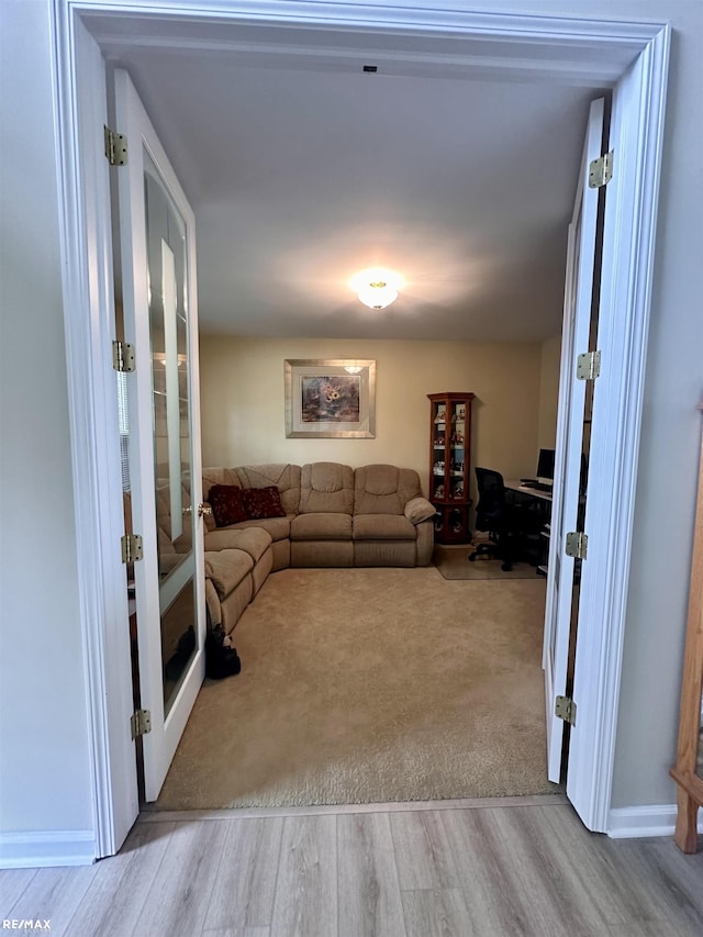 39148 Canterbury Dr, Harrison Twp, MI 48045 - living room featuring french doors, wood finished floors, and a desk