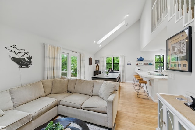 3620 Lakeshore Dr, Lapeer, MI 48446 - living room with high vaulted ceiling, light wood-type flooring, a skylight, and recessed lighting