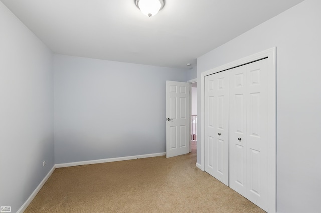 3620 Lakeshore Dr, Lapeer, MI 48446 - unfurnished bedroom with light colored carpet, a closet, and baseboards