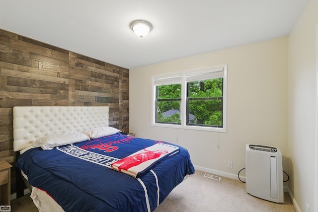 3620 Lakeshore Dr, Lapeer, MI 48446 - carpeted bedroom featuring wooden walls and baseboards