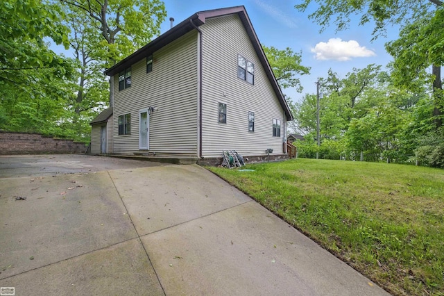 3620 Lakeshore Dr, Lapeer, MI 48446 - view of side of property featuring a lawn and driveway