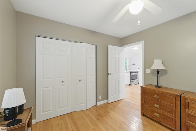 3620 Lakeshore Dr, Lapeer, MI 48446 - bedroom with light wood-type flooring, a closet, a ceiling fan, and baseboards