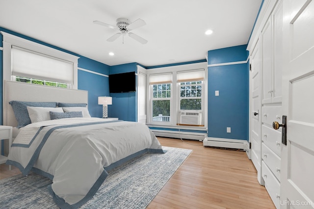 624 E G St, Iron Mountain, MI 49801 - bedroom featuring light wood-style floors, cooling unit, recessed lighting, baseboards, and a ceiling fan