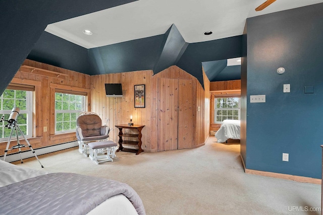624 E G St, Iron Mountain, MI 49801 - carpeted bedroom featuring a baseboard heating unit, lofted ceiling, wood walls, and baseboards