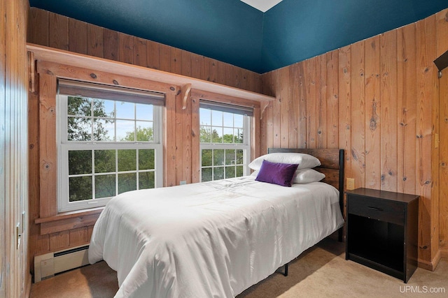 624 E G St, Iron Mountain, MI 49801 - carpeted bedroom featuring a baseboard heating unit and wood walls