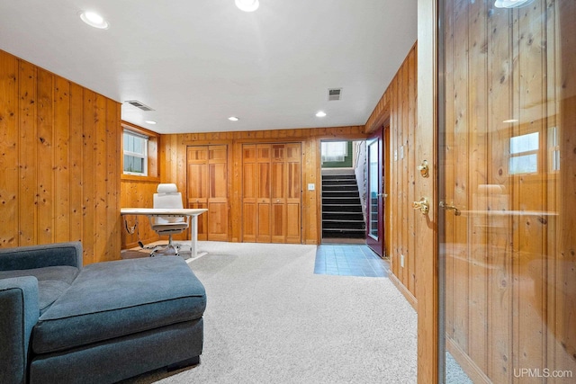 624 E G St, Iron Mountain, MI 49801 - sitting room with wooden walls, stairway, carpet floors, and recessed lighting