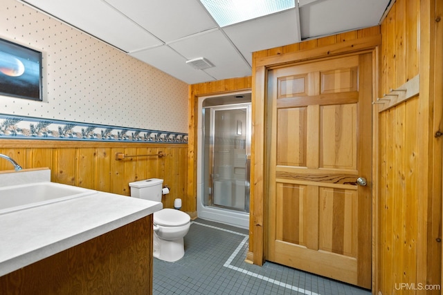 624 E G St, Iron Mountain, MI 49801 - bathroom featuring an enclosed shower, toilet, vanity, wooden walls, and wallpapered walls