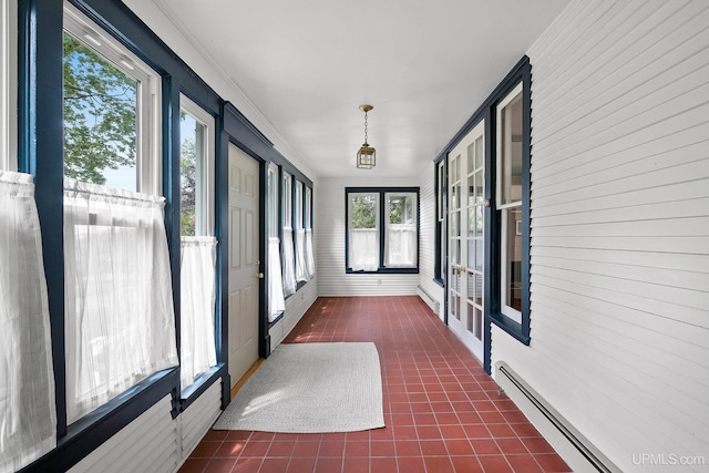 624 E G St, Iron Mountain, MI 49801 - unfurnished sunroom featuring a baseboard radiator, tile patterned floors, and french doors