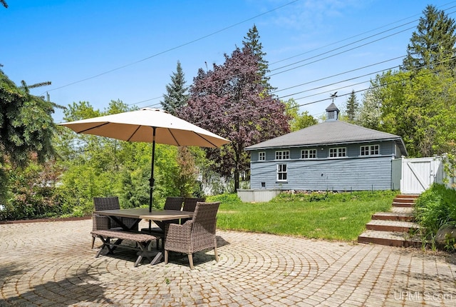 624 E G St, Iron Mountain, MI 49801 - view of patio featuring a gate and outdoor dining space
