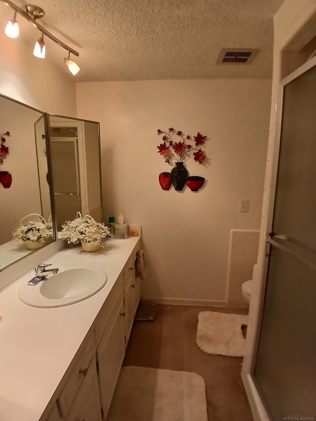 22460 La Von St, Saint Clair Shores, MI 48081 - bathroom with vanity, a stall shower, toilet, and a textured ceiling