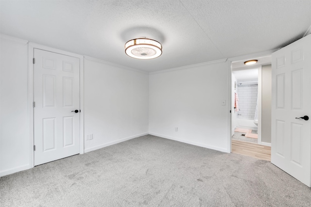 1371 Sturdevant St, Kimball, MI 48074 - unfurnished bedroom with carpet flooring, a textured ceiling, and baseboards