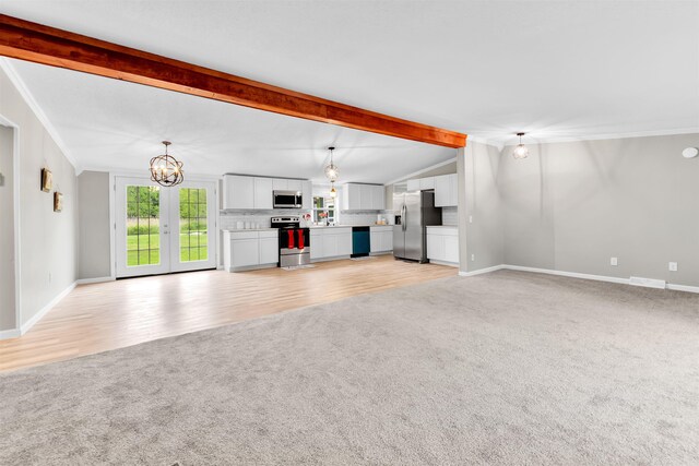 1371 Sturdevant St, Kimball, MI 48074 - unfurnished living room with light colored carpet, a chandelier, baseboards, crown molding, and light wood-type flooring