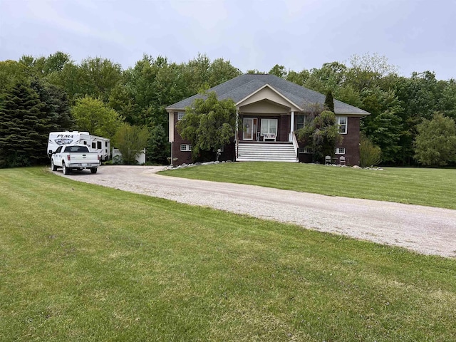 815 Cove Rd, Wales, MI 48027 - view of front of house with a front yard and a wooded view