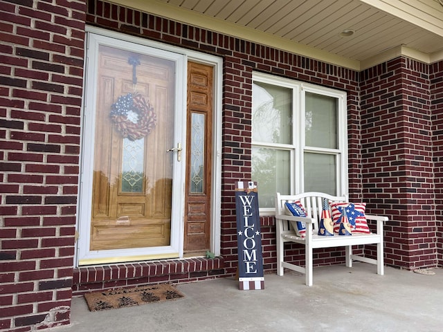 815 Cove Rd, Wales, MI 48027 - view of exterior entry featuring brick siding