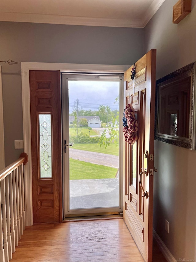 815 Cove Rd, Wales, MI 48027 - foyer entrance with crown molding and light wood-style flooring