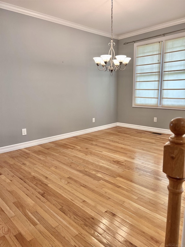 815 Cove Rd, Wales, MI 48027 - unfurnished room with light wood-style flooring, crown molding, a chandelier, and baseboards