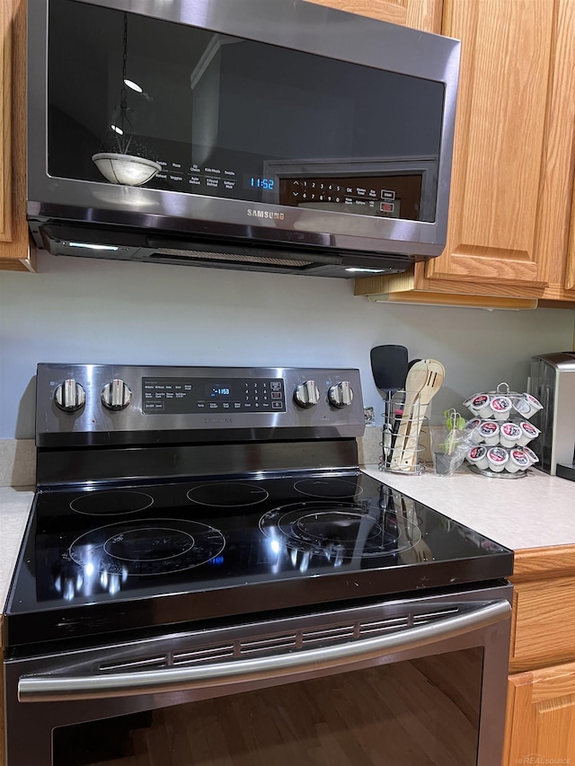 815 Cove Rd, Wales, MI 48027 - kitchen view of stainless steel appliances and light countertops