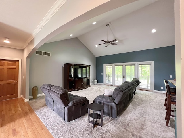 815 Cove Rd, Wales, MI 48027 - living room with arched walkways, baseboards, high vaulted ceiling, light wood-type flooring, and recessed lighting