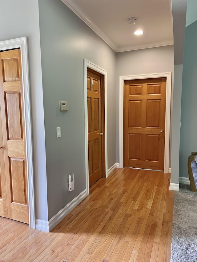 815 Cove Rd, Wales, MI 48027 - hall featuring crown molding, light wood-type flooring, and baseboards