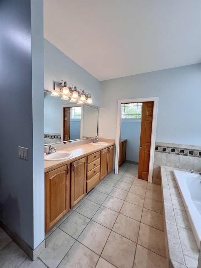 815 Cove Rd, Wales, MI 48027 - bathroom with double vanity, a garden tub, and tile patterned floors