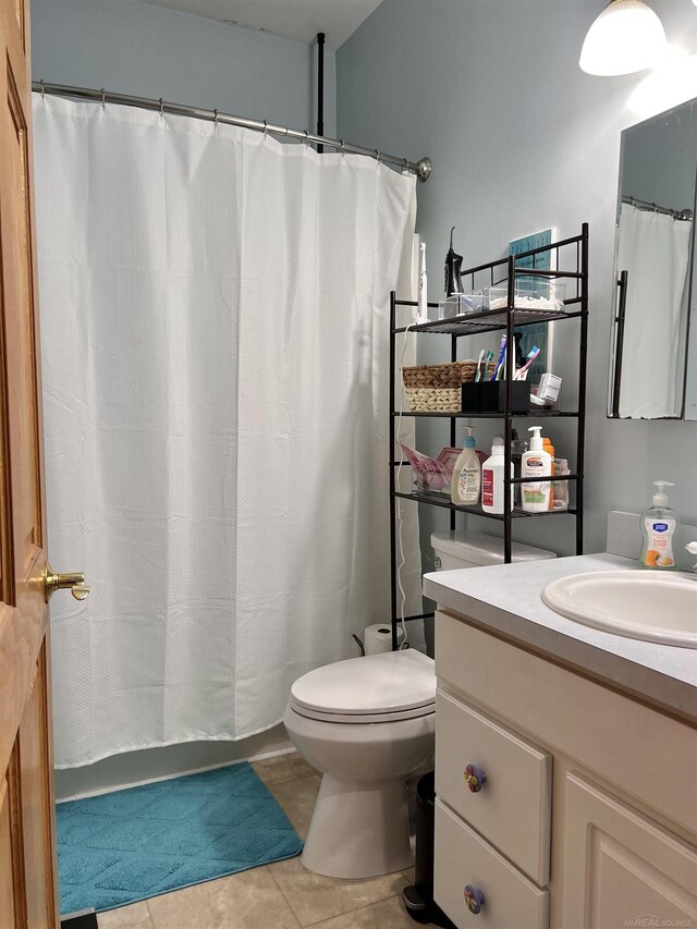 815 Cove Rd, Wales, MI 48027 - bathroom with vanity, toilet, tile patterned floors, and a shower with curtain