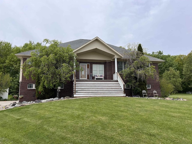 815 Cove Rd, Wales, MI 48027 - view of front of property with brick siding, a front lawn, and a porch