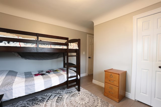 23300 Allor St, Saint Clair Shores, MI 48082 - bedroom featuring baseboards and light wood-style flooring