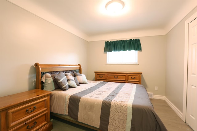 23300 Allor St, Saint Clair Shores, MI 48082 - bedroom featuring wood finished floors and baseboards