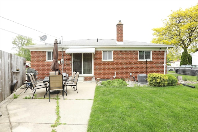 23300 Allor St, Saint Clair Shores, MI 48082 - back of property with a chimney, brick siding, central AC, and a patio