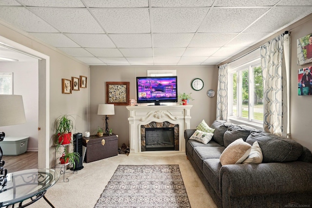 1471 James St, Burton, MI 48529 - carpeted living room featuring a paneled ceiling and a fireplace