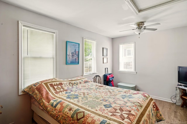 1471 James St, Burton, MI 48529 - bedroom with wood finished floors, baseboards, and ceiling fan